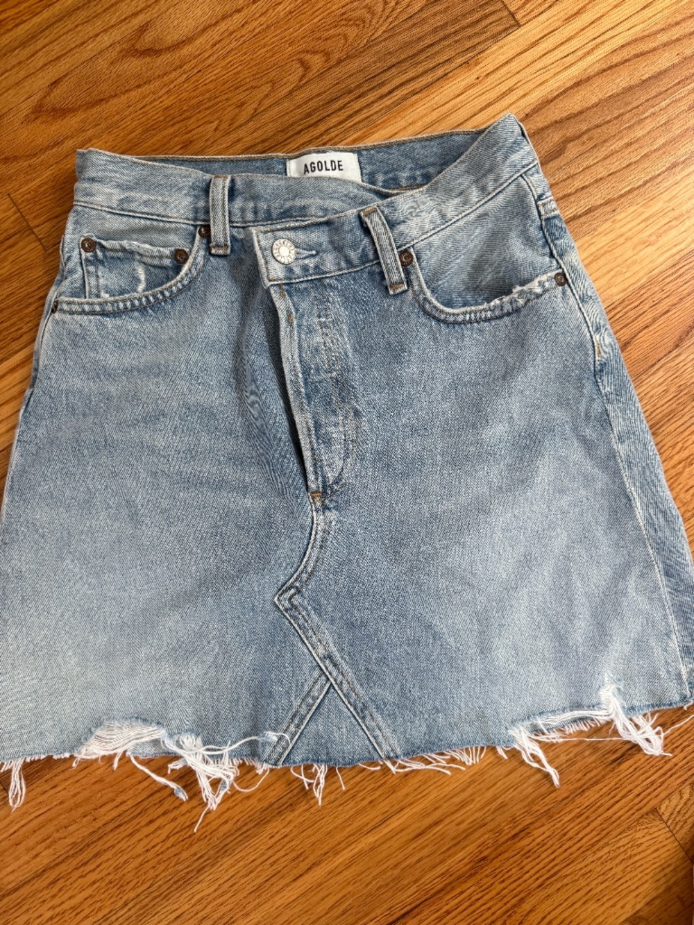 AGOLDE Criss Cross Denim Skirt Women's Size 23 Light Blue Asymmetric Raw Hem